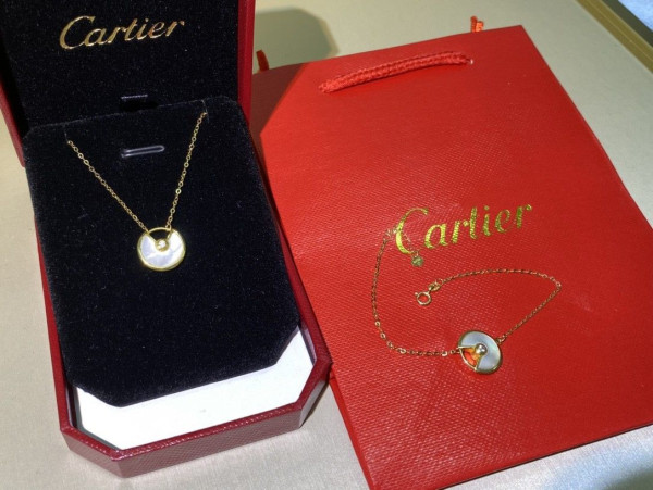 Ca*t*er  amulet necklace